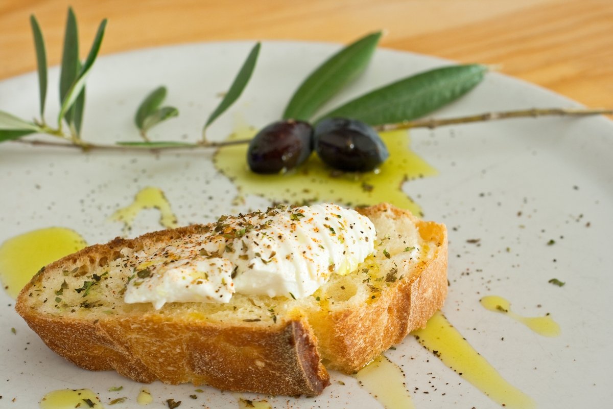 A slice of mediterranean bread with greek extra virgin olive oil