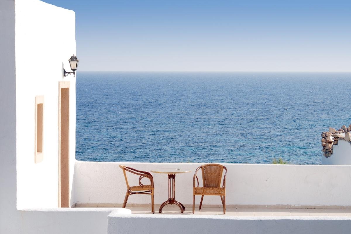 beautiful outdoor table in a Greek vacation rental home with Aegean sea view