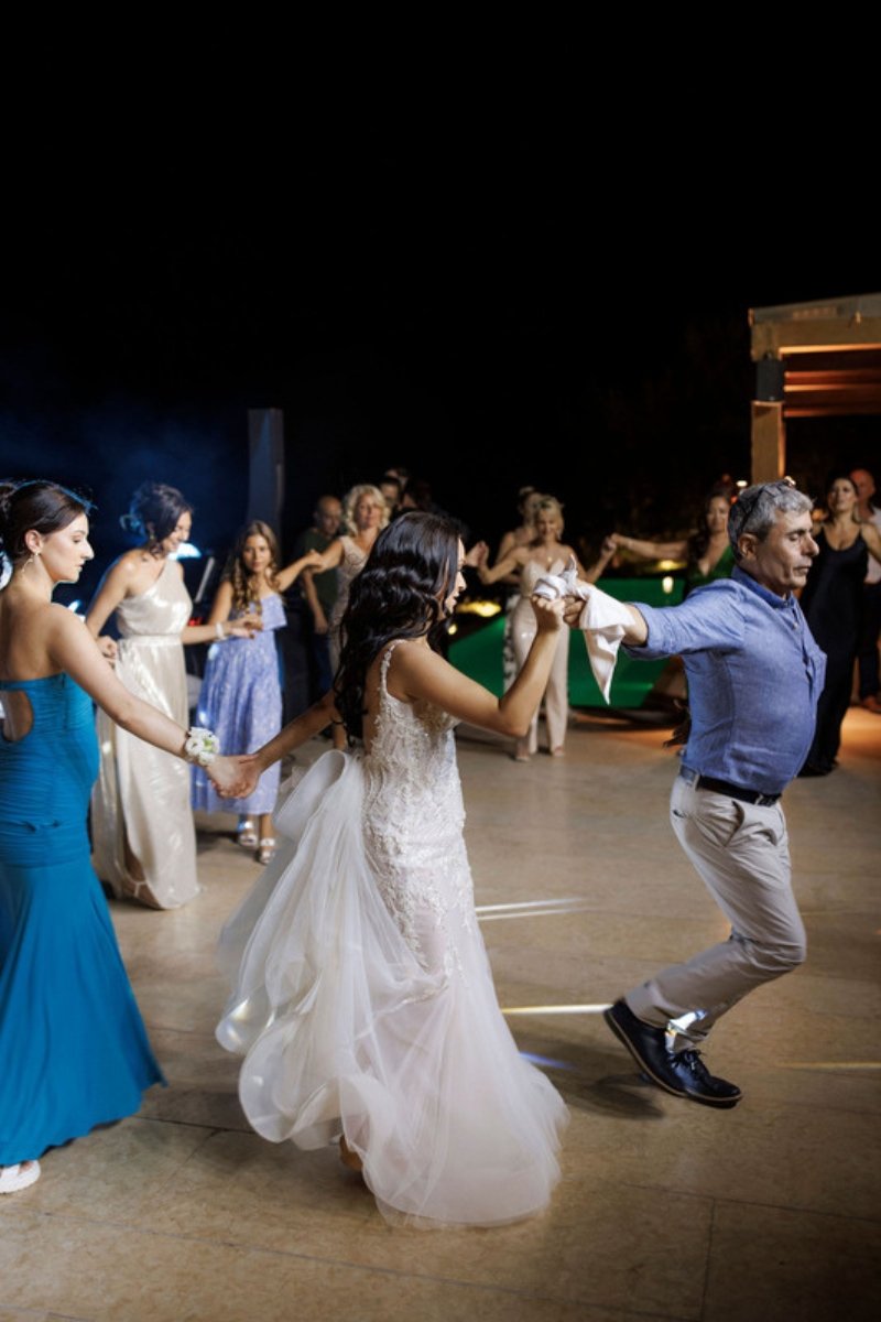 Bride and groom dancing the first traditional dance at a Greek wedding reception