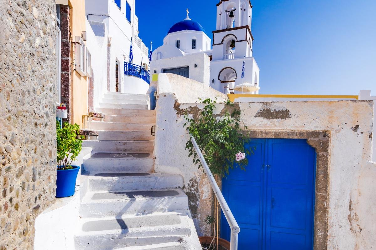 Stairs leading to a greek chapel in santorini walking mediterranean experience
